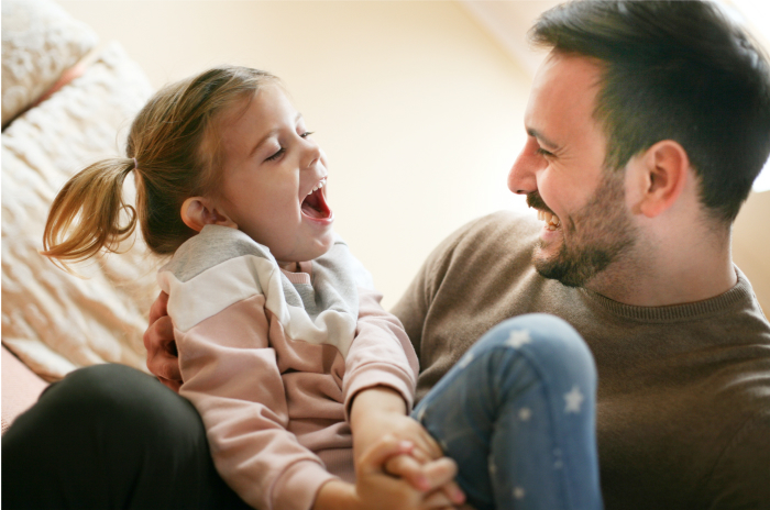 White Father Laughing with Daughter