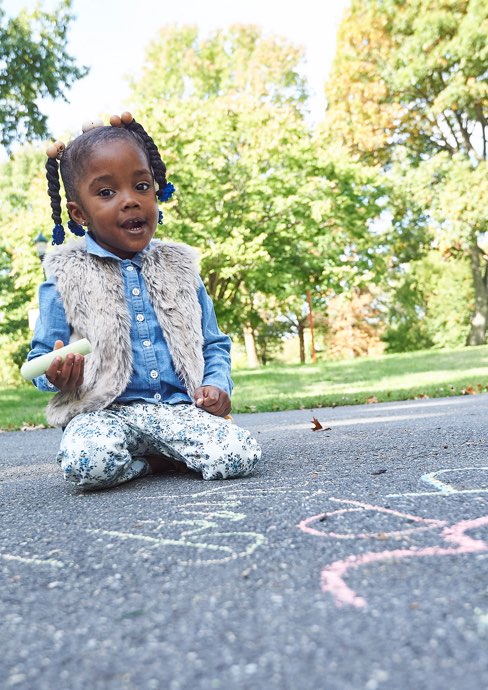 Little Girl Using Chalk on Sidewalk
