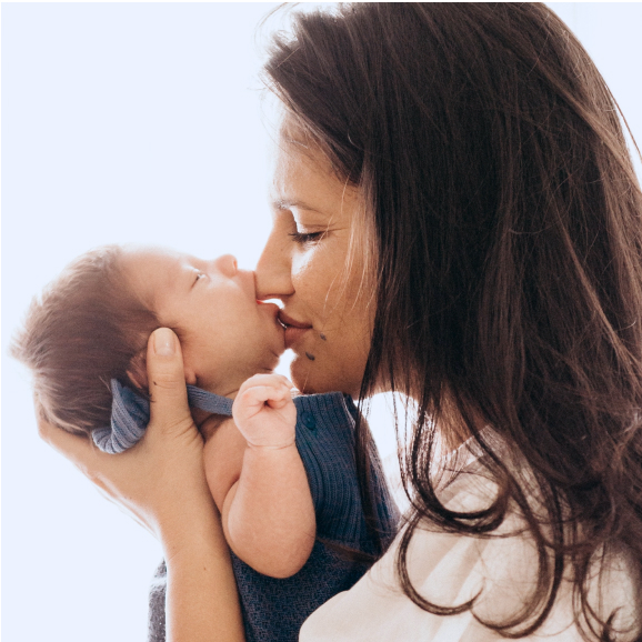 Mother Kissing Baby