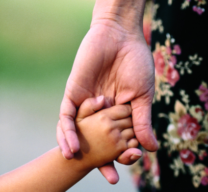 Child and Parent Holding Hands