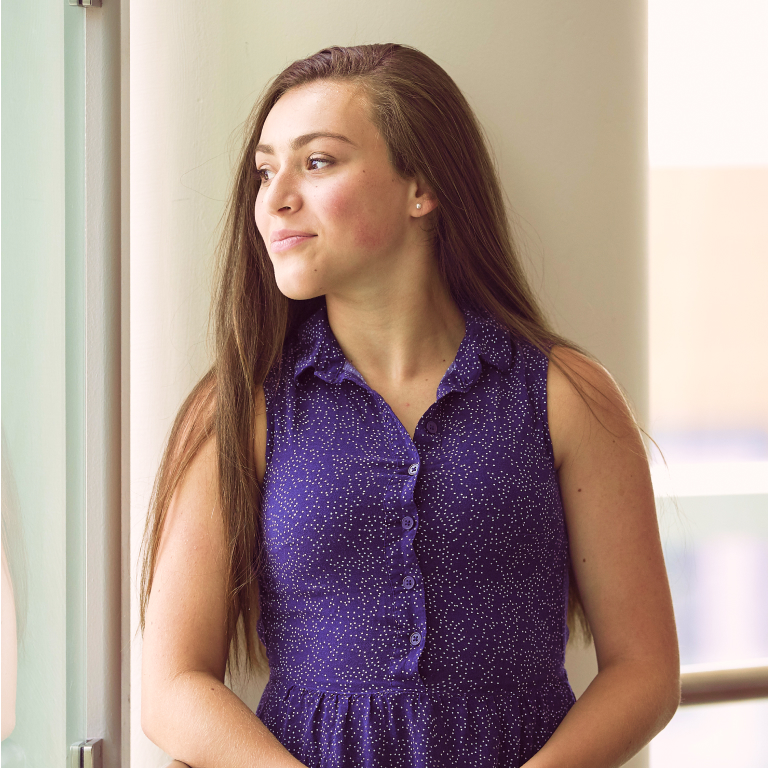 White Teen Girl Smiling and Looking To The Side