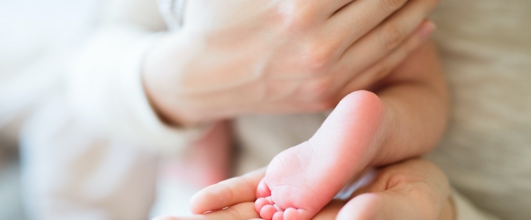 mother holding baby